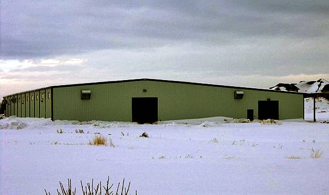Horse riding arena with barns